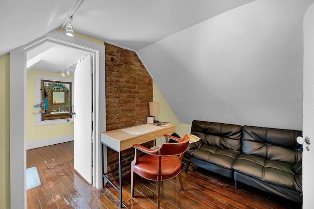 home office with hardwood / wood-style floors and vaulted ceiling