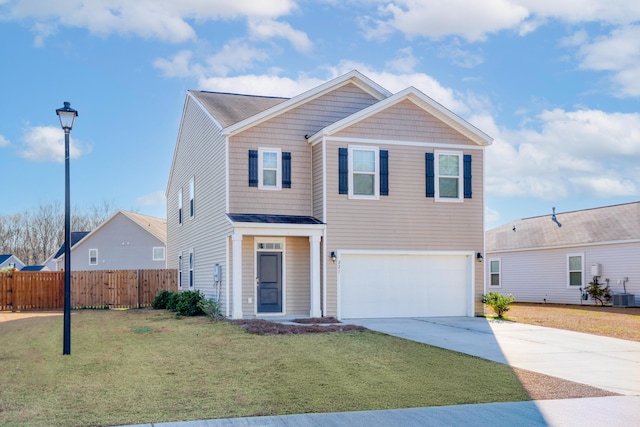 view of property featuring a front yard, central AC unit, and a garage