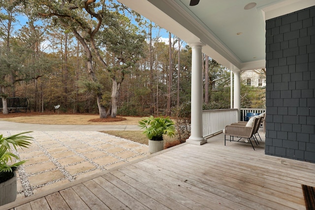 wooden deck with ceiling fan and a porch