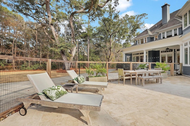 view of patio / terrace featuring ceiling fan