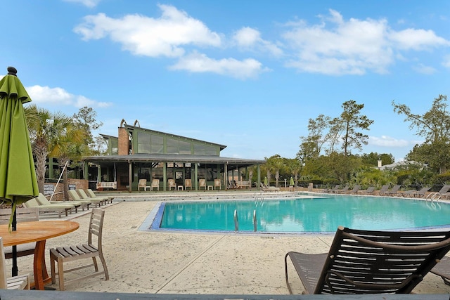 view of swimming pool featuring a patio area