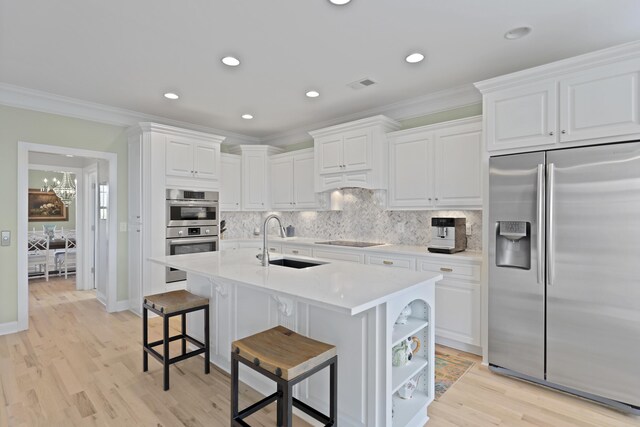 1216 Rivers Reach Dr, Charleston, SC 29492 - kitchen featuring stainless steel appliances, a sink, backsplash, white cabinetry, and crown molding