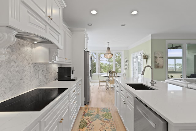 1216 Rivers Reach Dr, Charleston, SC 29492 - kitchen with appliances with stainless steel finishes, a sink, premium range hood, light wood-type flooring, and white cabinets