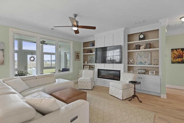 1216 Rivers Reach Dr, Charleston, SC 29492 - living room featuring baseboards, a ceiling fan, crown molding, a fireplace, and light wood finished floors