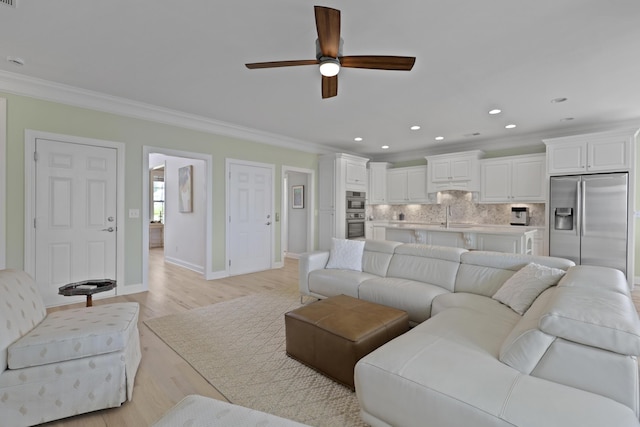 1216 Rivers Reach Dr, Charleston, SC 29492 - living room with crown molding, a ceiling fan, baseboards, light wood-type flooring, and recessed lighting