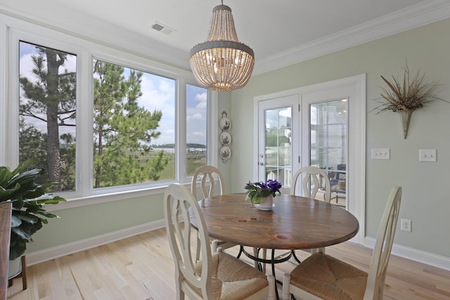 1216 Rivers Reach Dr, Charleston, SC 29492 - dining room with crown molding, light wood finished floors, a chandelier, and baseboards