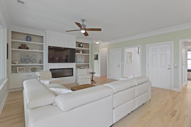 1216 Rivers Reach Dr, Charleston, SC 29492 - living room with ceiling fan, light wood-style flooring, crown molding, a fireplace, and baseboards