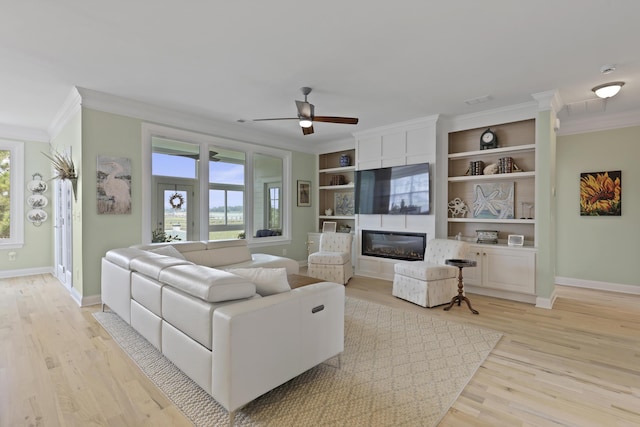 1216 Rivers Reach Dr, Charleston, SC 29492 - living room with ornamental molding, baseboards, a ceiling fan, light wood finished floors, and a fireplace