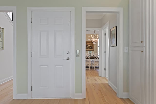 1216 Rivers Reach Dr, Charleston, SC 29492 - hallway featuring a chandelier, light wood-style floors, crown molding, and baseboards