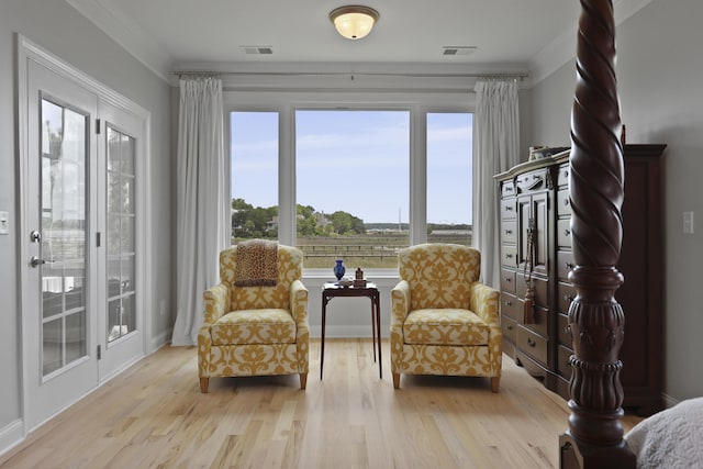 1216 Rivers Reach Dr, Charleston, SC 29492 - sitting room with light wood-style floors and ornamental molding