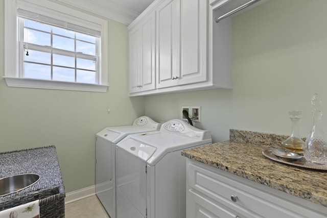 1216 Rivers Reach Dr, Charleston, SC 29492 - washroom featuring independent washer and dryer, cabinet space, and baseboards