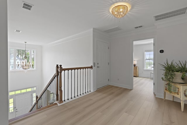 1216 Rivers Reach Dr, Charleston, SC 29492 - hallway featuring a chandelier, light wood-style flooring, an upstairs landing, crown molding, and baseboards