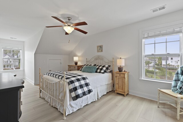 1216 Rivers Reach Dr, Charleston, SC 29492 - bedroom featuring multiple windows, light wood-style floors, baseboards, and vaulted ceiling