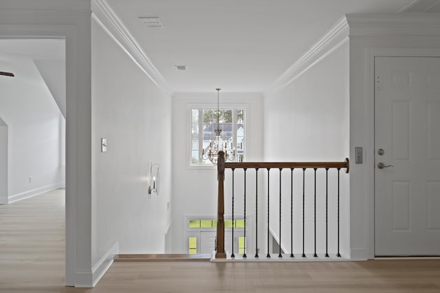 1216 Rivers Reach Dr, Charleston, SC 29492 - hallway featuring a chandelier, wood finished floors, ornamental molding, and baseboards