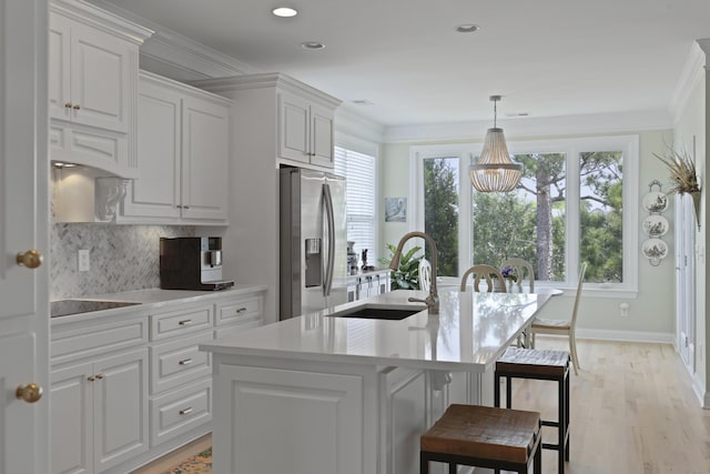 1216 Rivers Reach Dr, Charleston, SC 29492 - kitchen with stainless steel fridge with ice dispenser, a sink, a chandelier, a center island with sink, and a breakfast bar