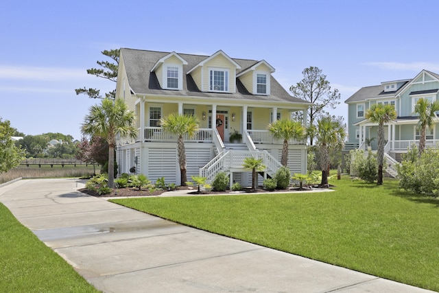 1216 Rivers Reach Dr, Charleston, SC 29492 - view of front of property with stairs, covered porch, a front yard, and concrete driveway