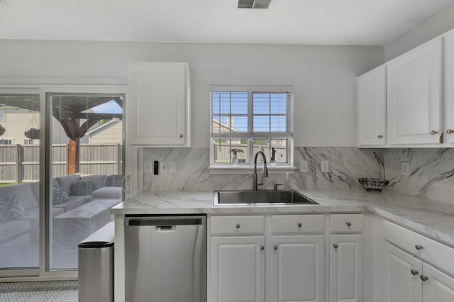 7838 Long Shadow Ln, North Charleston, SC 29406 - kitchen featuring stainless steel dishwasher, a sink, white cabinetry, and backsplash