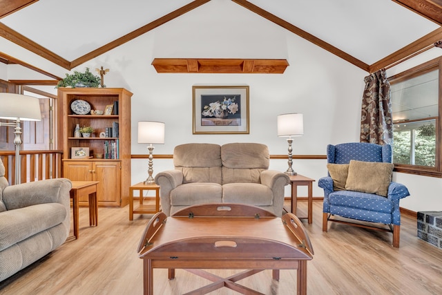 living room featuring high vaulted ceiling, baseboards, and light wood finished floors