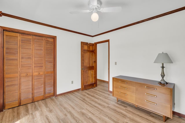 unfurnished bedroom featuring a closet, light wood-type flooring, a ceiling fan, and baseboards