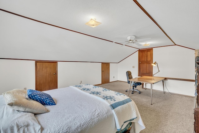 carpeted bedroom featuring vaulted ceiling and baseboards