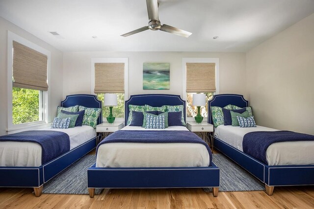 bedroom featuring ceiling fan and hardwood / wood-style flooring