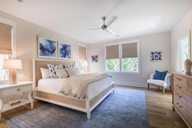 bedroom featuring ceiling fan and dark hardwood / wood-style flooring