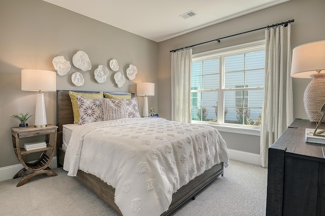 bedroom featuring carpet floors and baseboards