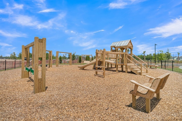 community jungle gym featuring fence