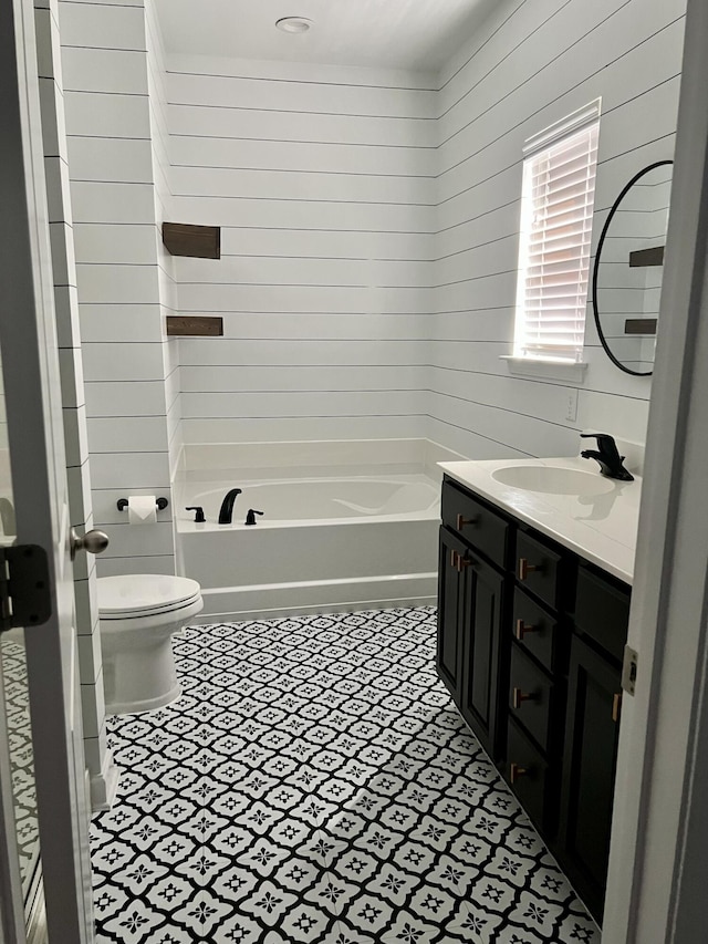 259 Weeping Cypress Dr, Moncks Corner, SC 29461 - full bath featuring vanity, toilet, wood walls, and tile patterned flooring