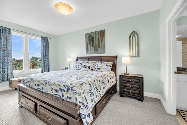 bedroom with light colored carpet