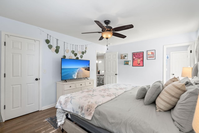 bedroom with ceiling fan and dark hardwood / wood-style flooring