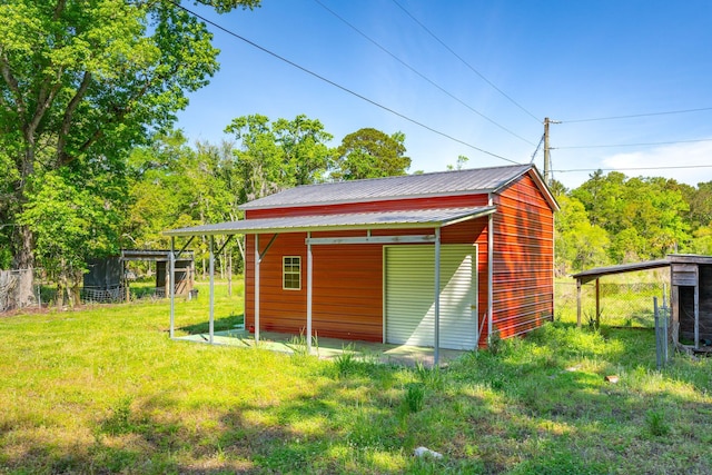 view of outdoor structure with a lawn