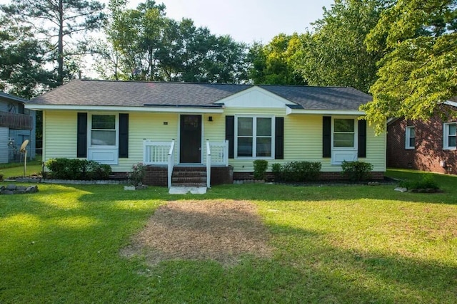 ranch-style house with a front lawn