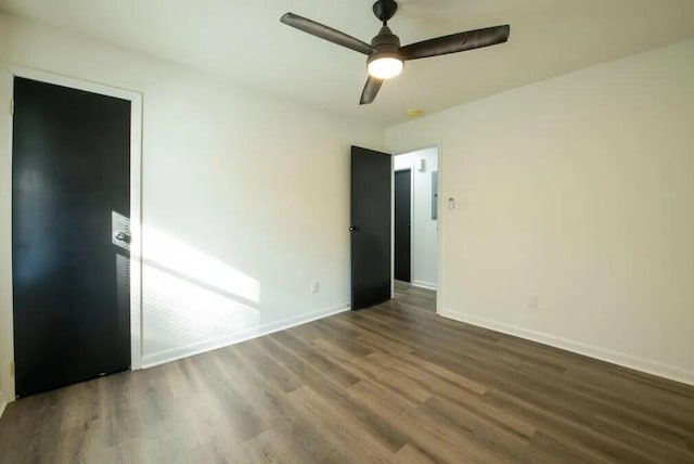 spare room featuring hardwood / wood-style floors and ceiling fan