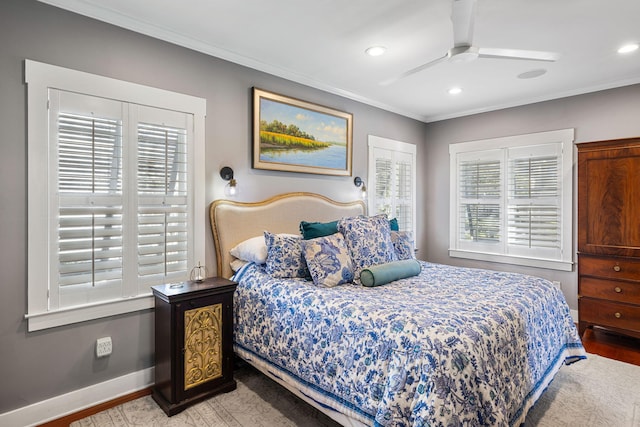 bedroom with ceiling fan, light wood-type flooring, and ornamental molding