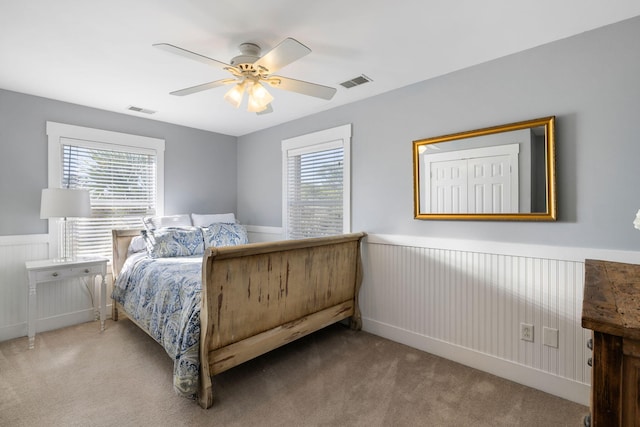 carpeted bedroom featuring ceiling fan