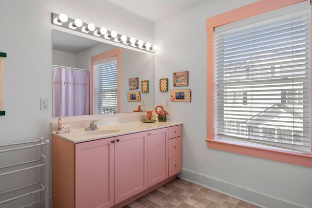 bathroom featuring vanity and a healthy amount of sunlight