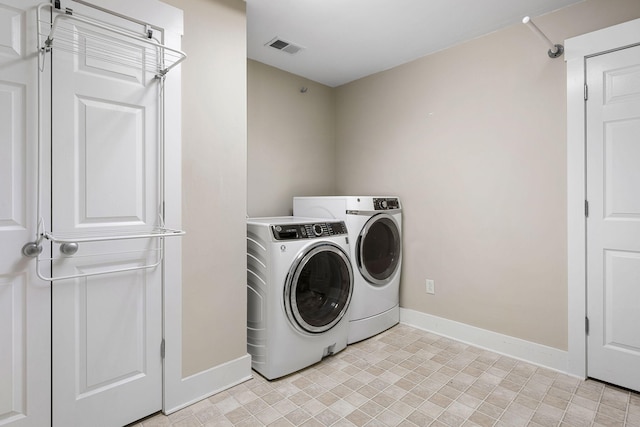 laundry room with washer and dryer