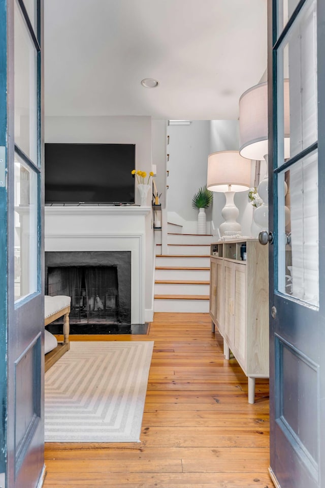 entryway with hardwood / wood-style flooring