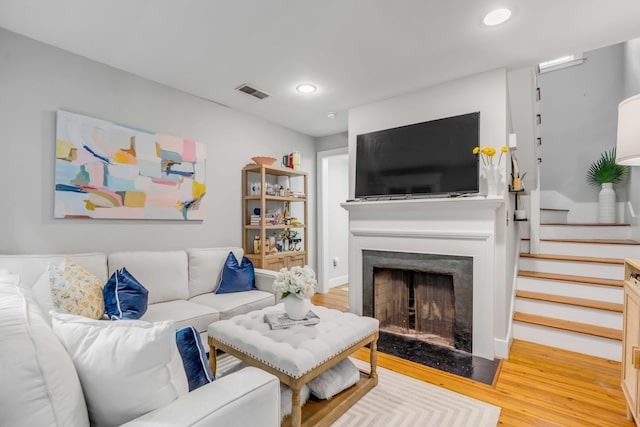 living room with light hardwood / wood-style floors