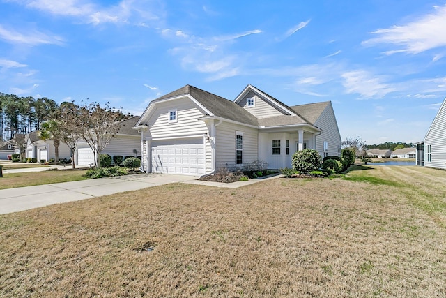 109 Billowing Sails St, Summerville, SC 29486 - view of front facade featuring an attached garage, concrete driveway, a front yard, and a shingled roof