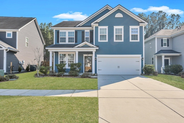 traditional-style house with driveway, a garage, and a front yard