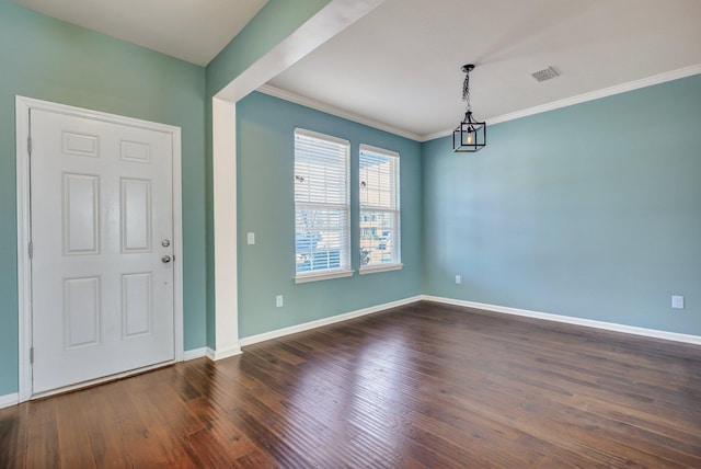 entryway featuring dark wood-style floors, baseboards, and crown molding