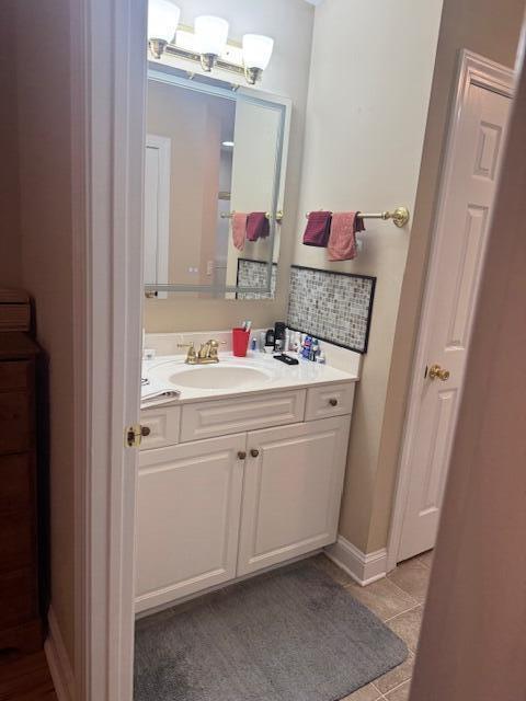 bathroom featuring tile patterned flooring and vanity