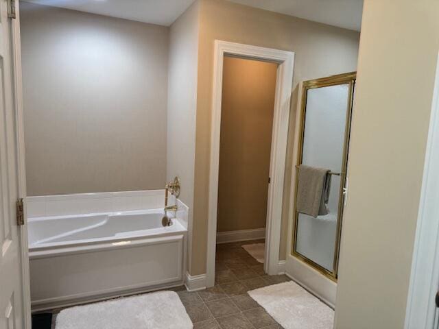 bathroom featuring separate shower and tub and tile patterned floors