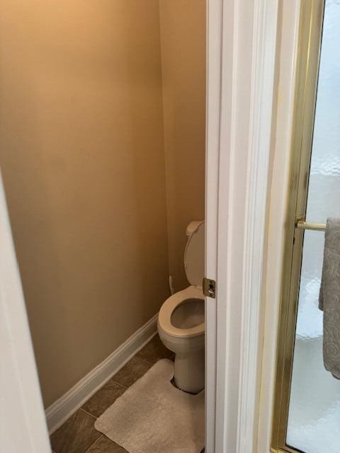 bathroom with tile patterned floors and toilet