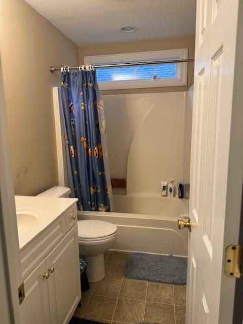 full bathroom featuring tile patterned floors, shower / bath combination with curtain, toilet, and vanity