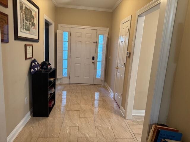 entryway featuring plenty of natural light and ornamental molding