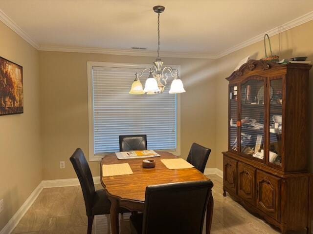 dining room with an inviting chandelier and ornamental molding