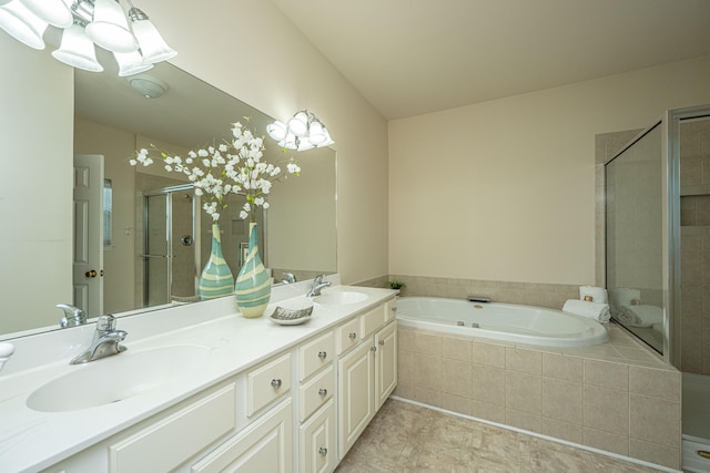 bathroom with vanity and independent shower and bath